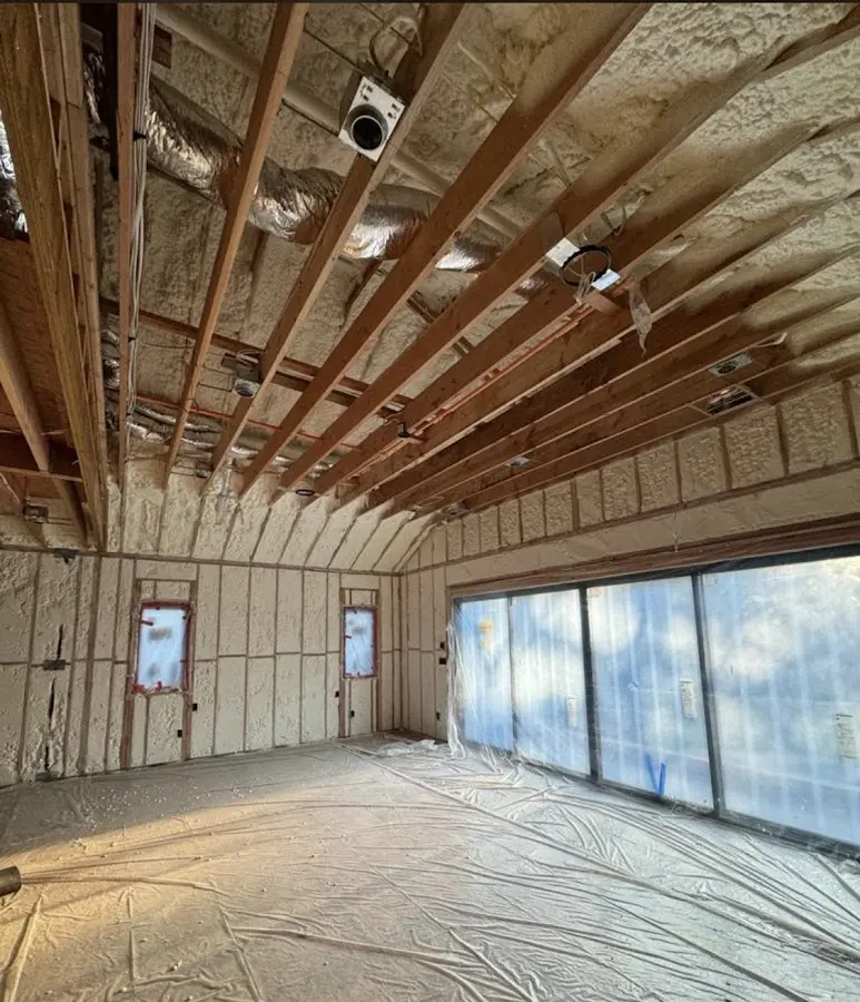 Interior walls and ceiling insulated with spray foam during new construction in Exeter